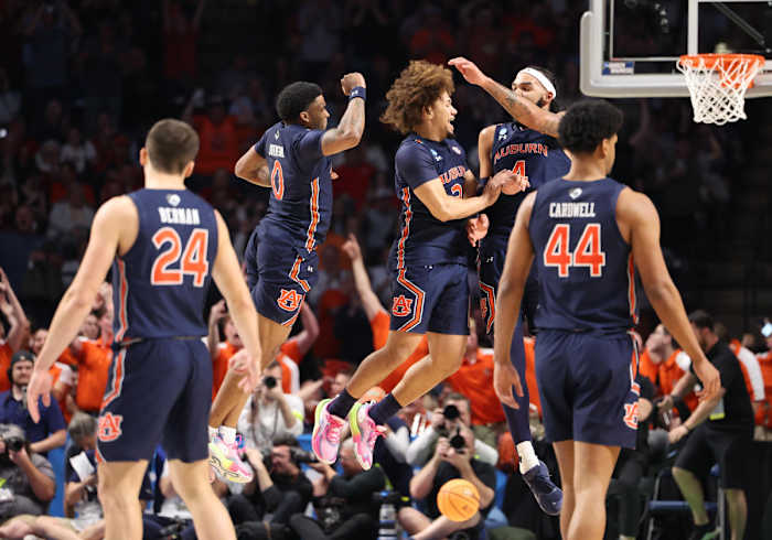 Auburn Tigers basketball players celebrate a win.